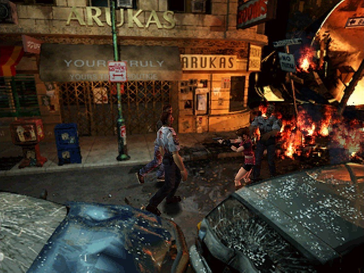 Calles de Raccoon City en llamas con zombis y coches destrozados en Resident Evil 2